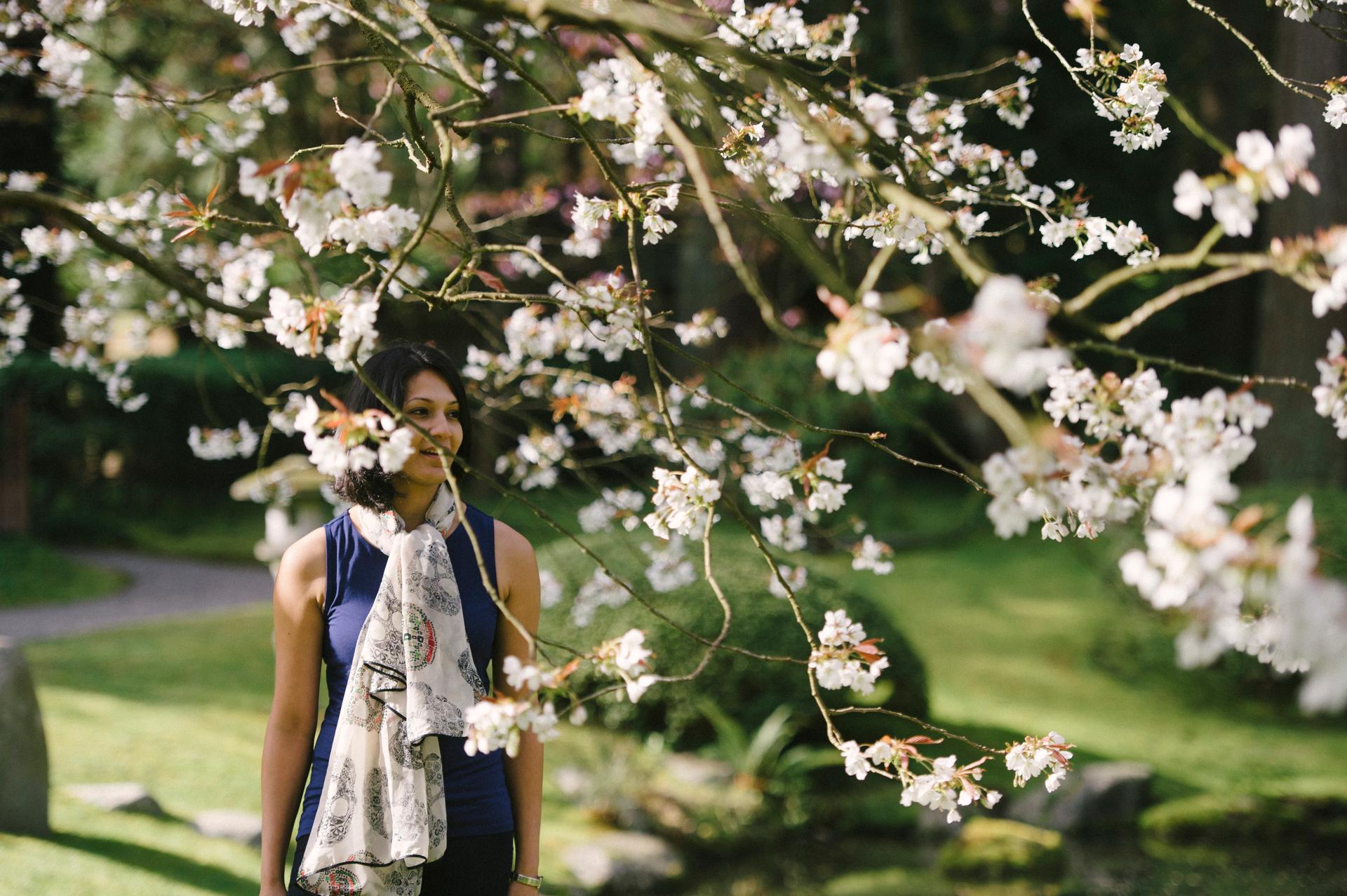 Lourdes walking under a cherry tree