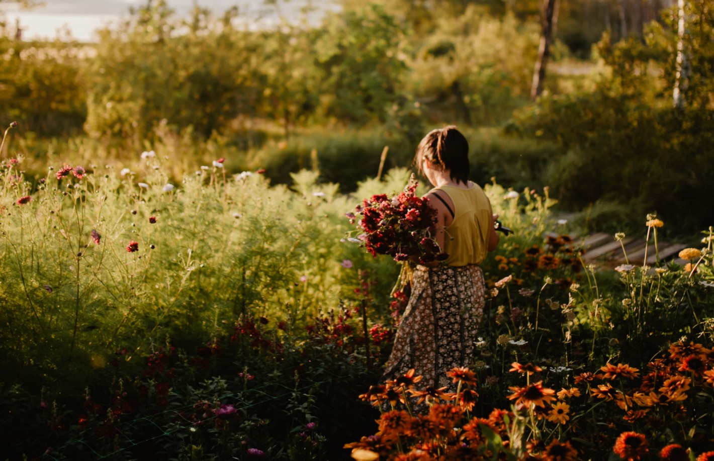 Lourdes picking flowers in a flower farm