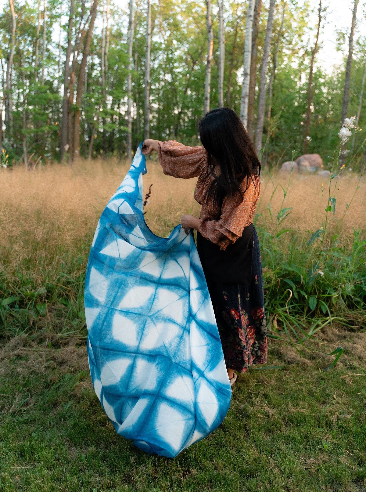 Person holding handmade tapestry