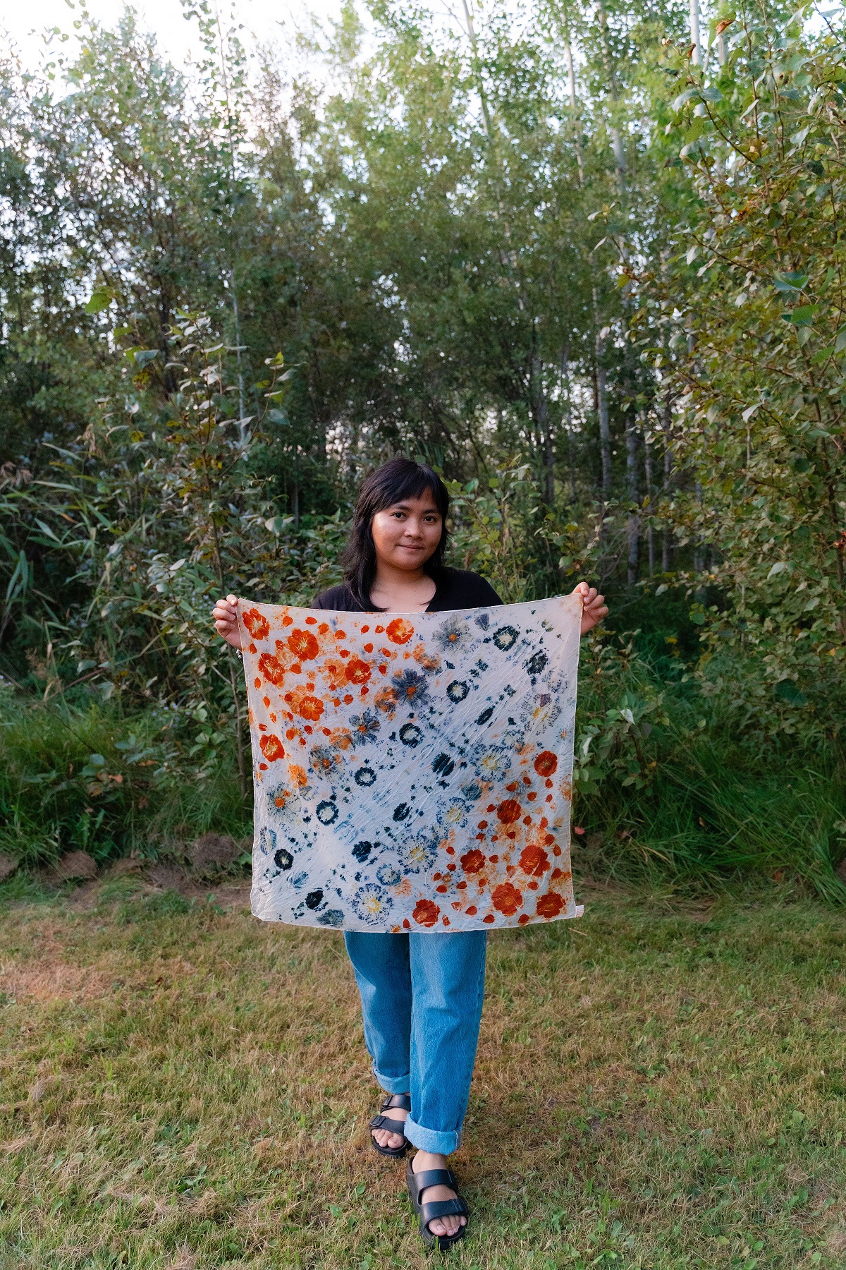 Person holding handmade tapestry