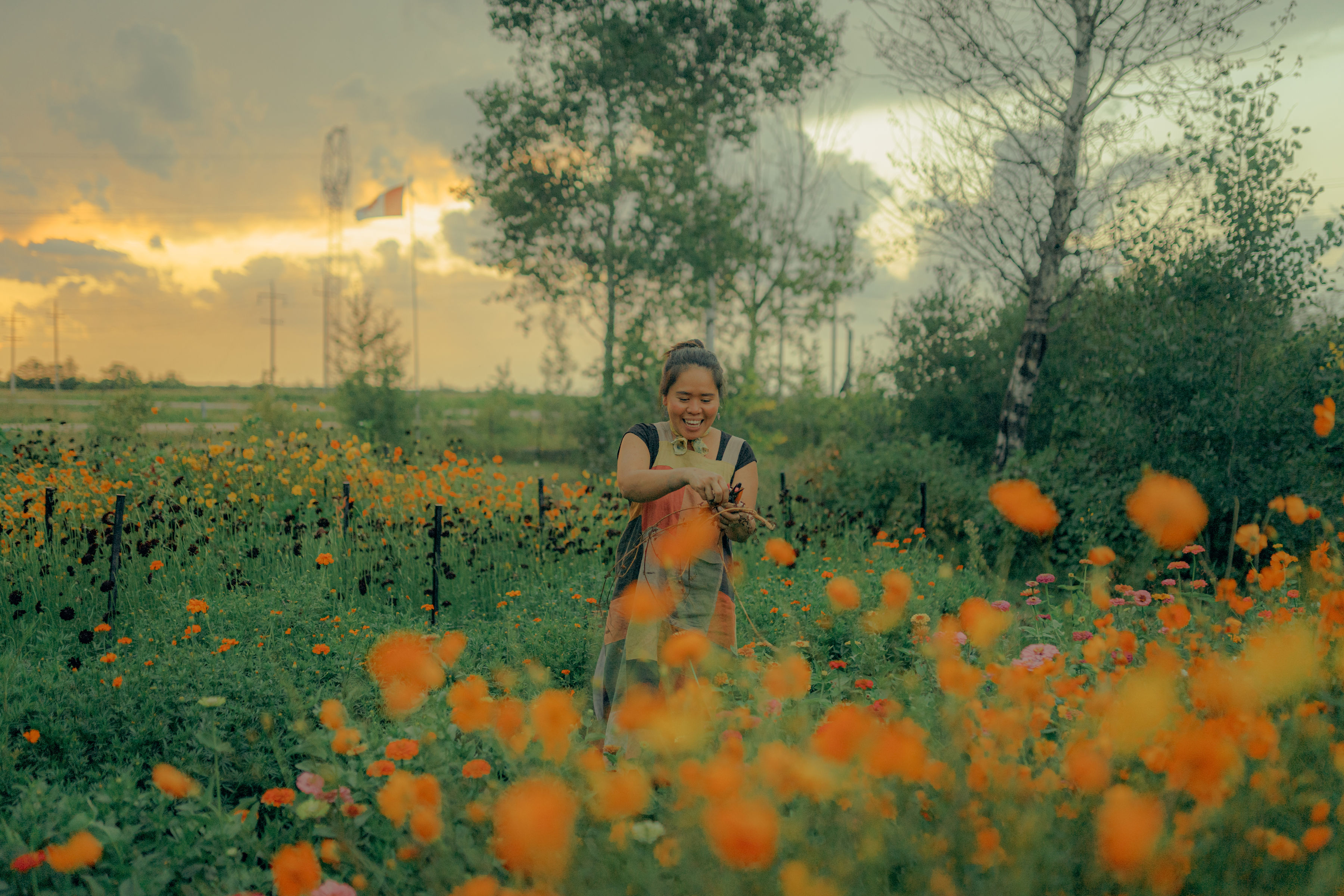 Lourdes standing in a flower field