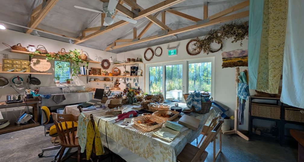 Rustic artist studio filled with wooden baskets and crafting supplies