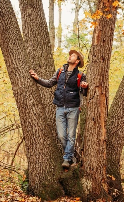 Dave Schonberger standing in a tree