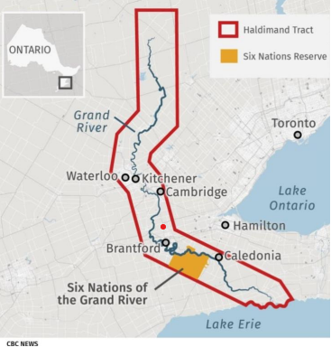 A map shows the Haldimand Tract (outlined in red) and the Six Nations Reserve (highlighted in orange) along the Grand River in Ontario, Canada, with nearby cities labeled.