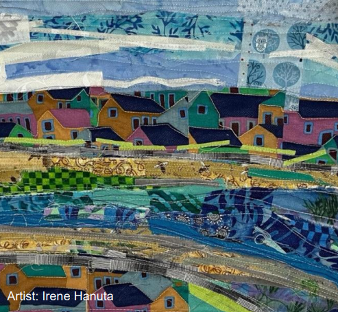 A colorful textile artwork depicts a landscape with houses and fields, crafted with various fabrics and patterns, credited to artist Irene Hanuta.